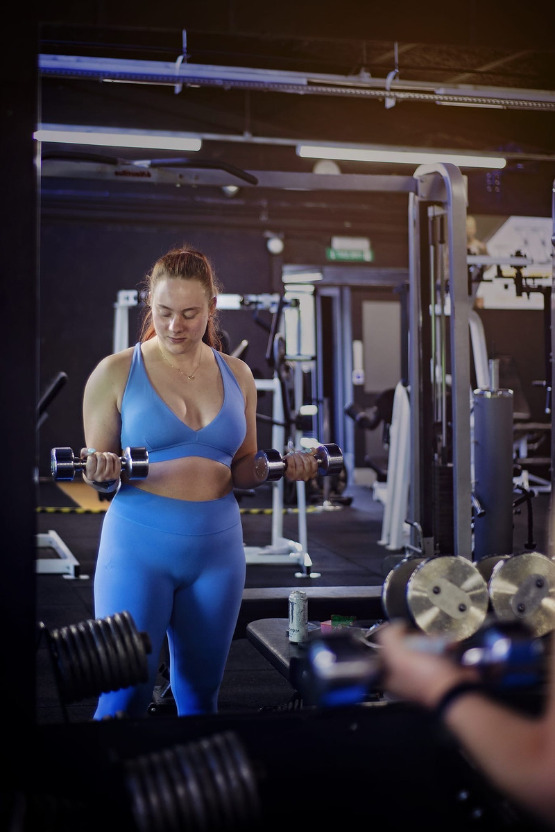 Emily training with dumbbells